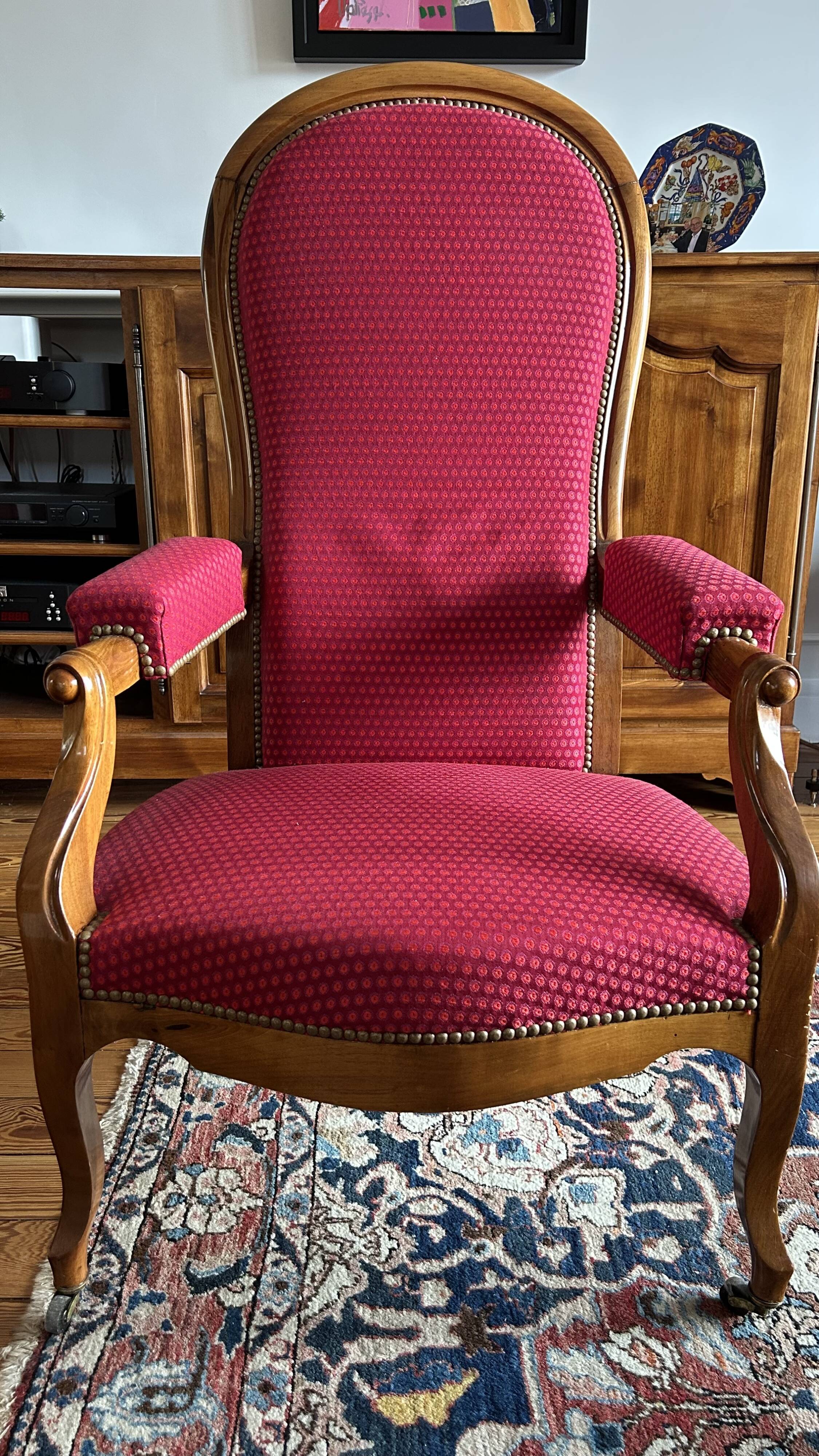 Antique Louis Philippe armchair in walnut and red fabric.