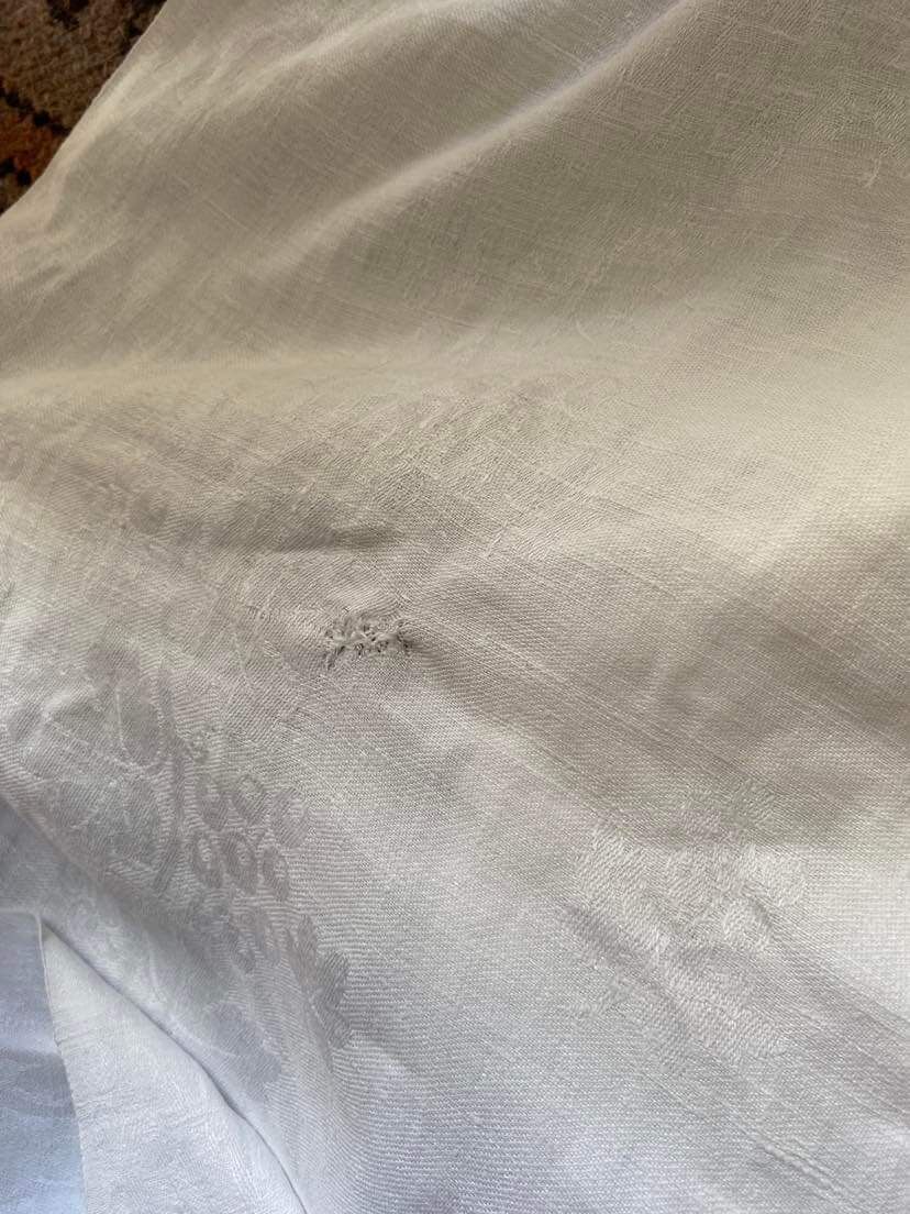 Old tablecloth in white cotton and monogram