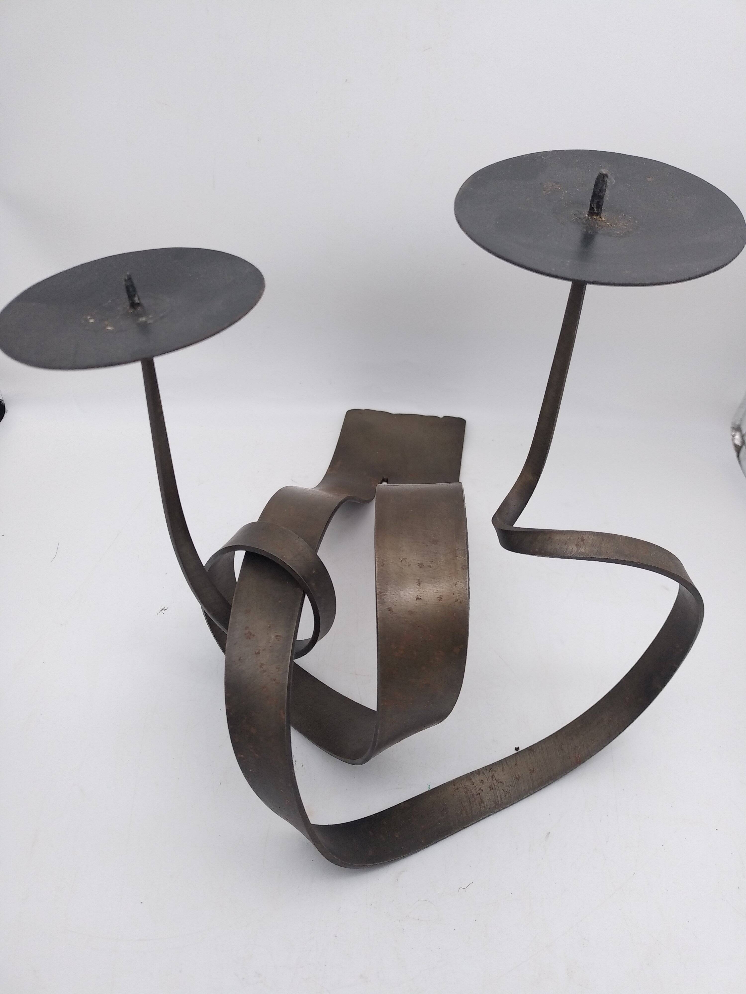Brutalist candle holder in bronze effect metal.