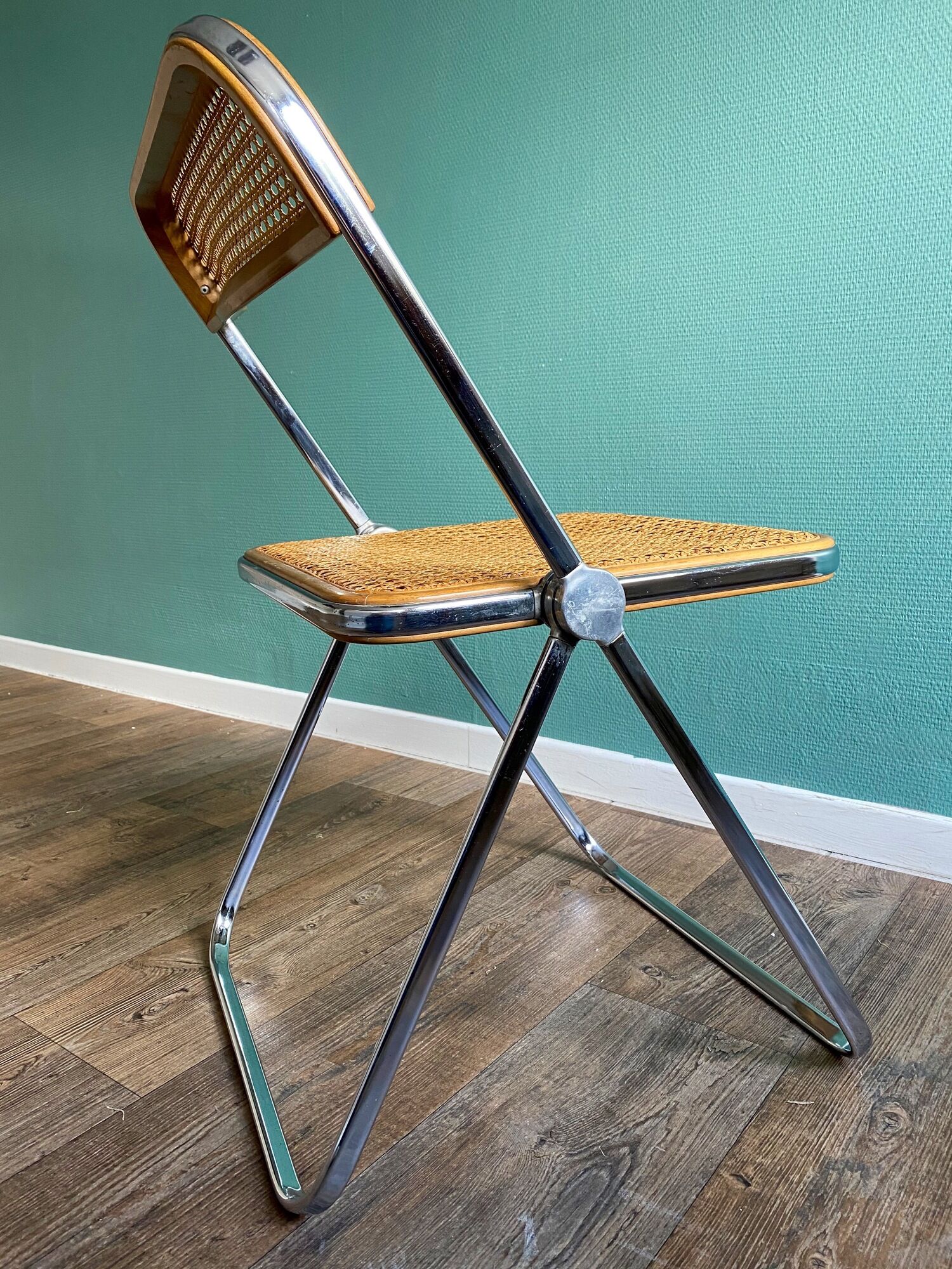 Wooden and caning folding chair "Plia" by G. Piretti for Castelli editions