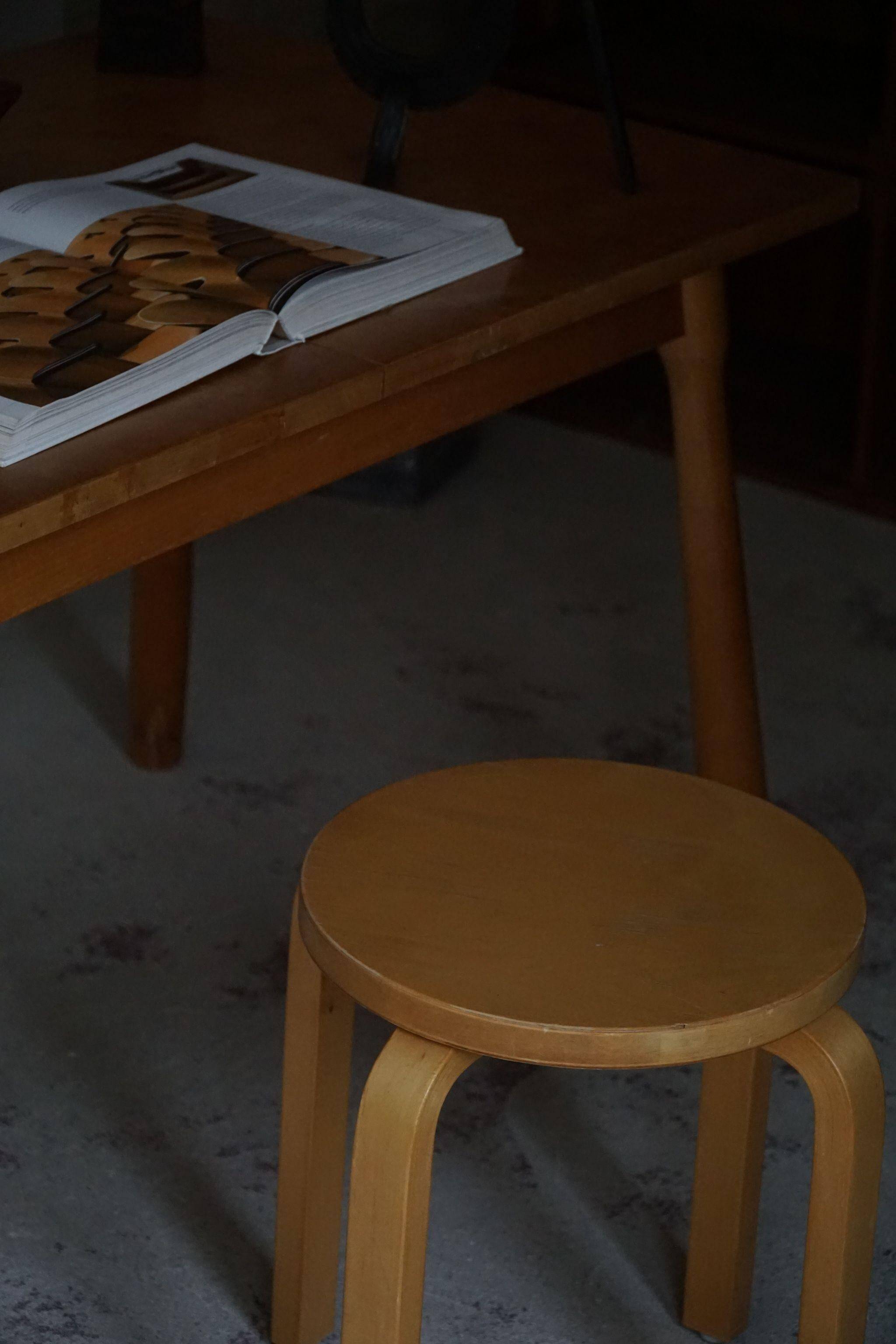 Alvar Aalto, a pair of vintage birch stools, model "60", made by Artek, 1970s.