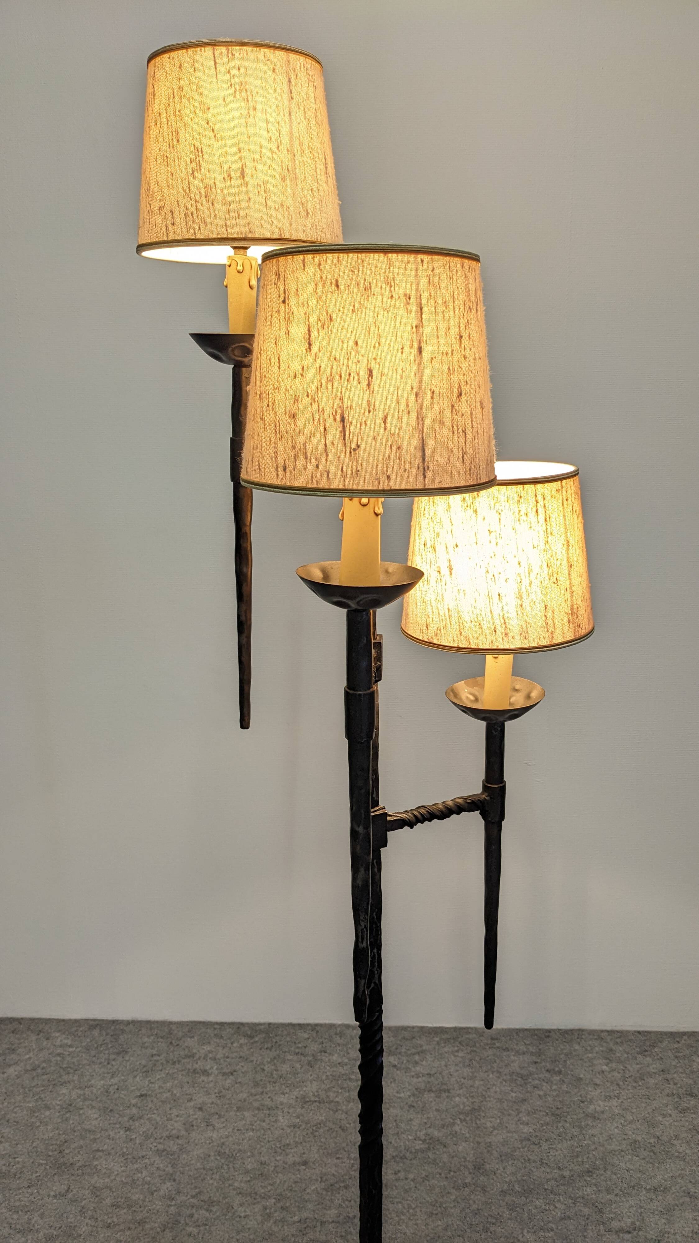 Brutalist tripod floor lamp with 3 lights in wrought iron, France circa 1950.