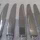 12 silver plated table knives by Argit goldsmith? Art Deco floral bands