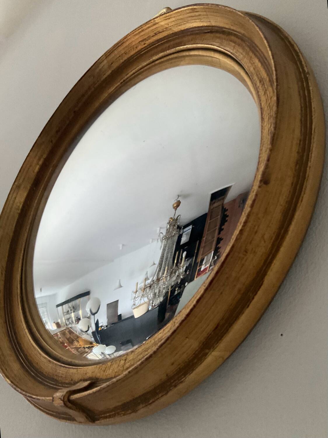 Vintage witch's eye mirror in gilded wood