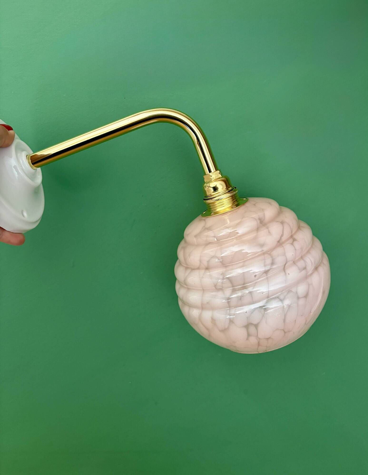 Vintage pink Clichy glass globe wall light.