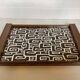 Vintage wooden tray with psychedelic Art Deco patterns.