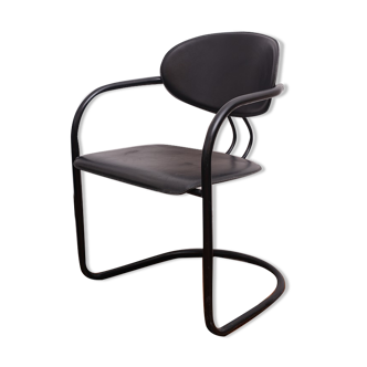 Black armchair with arched legs