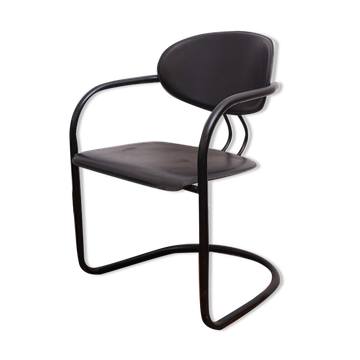 Black armchair with arched legs