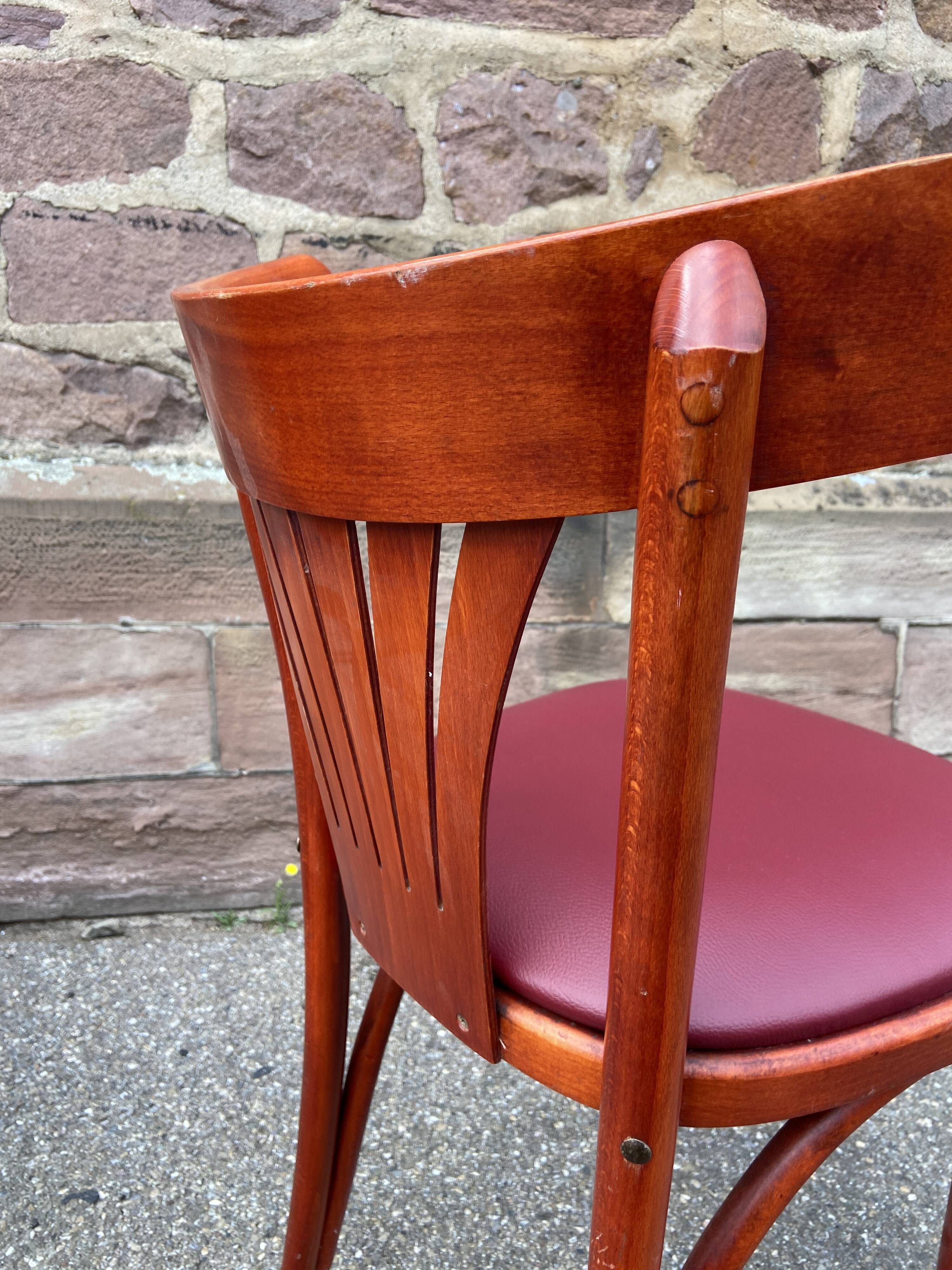 Pair of Alsatian bistro chairs in wood and leather, 1960