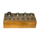 Complete set of brass weights for scales.