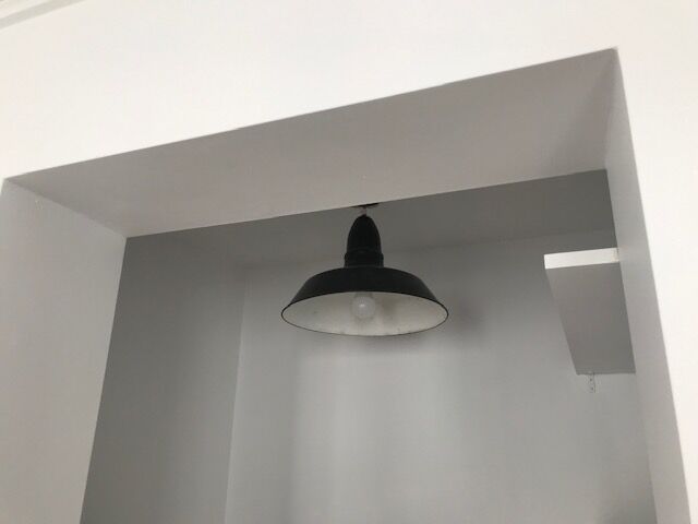 Old industrial suspension in enamelled sheet metal