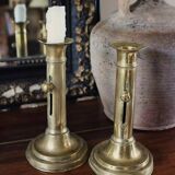 Pair of brass torch candle holders with pushers