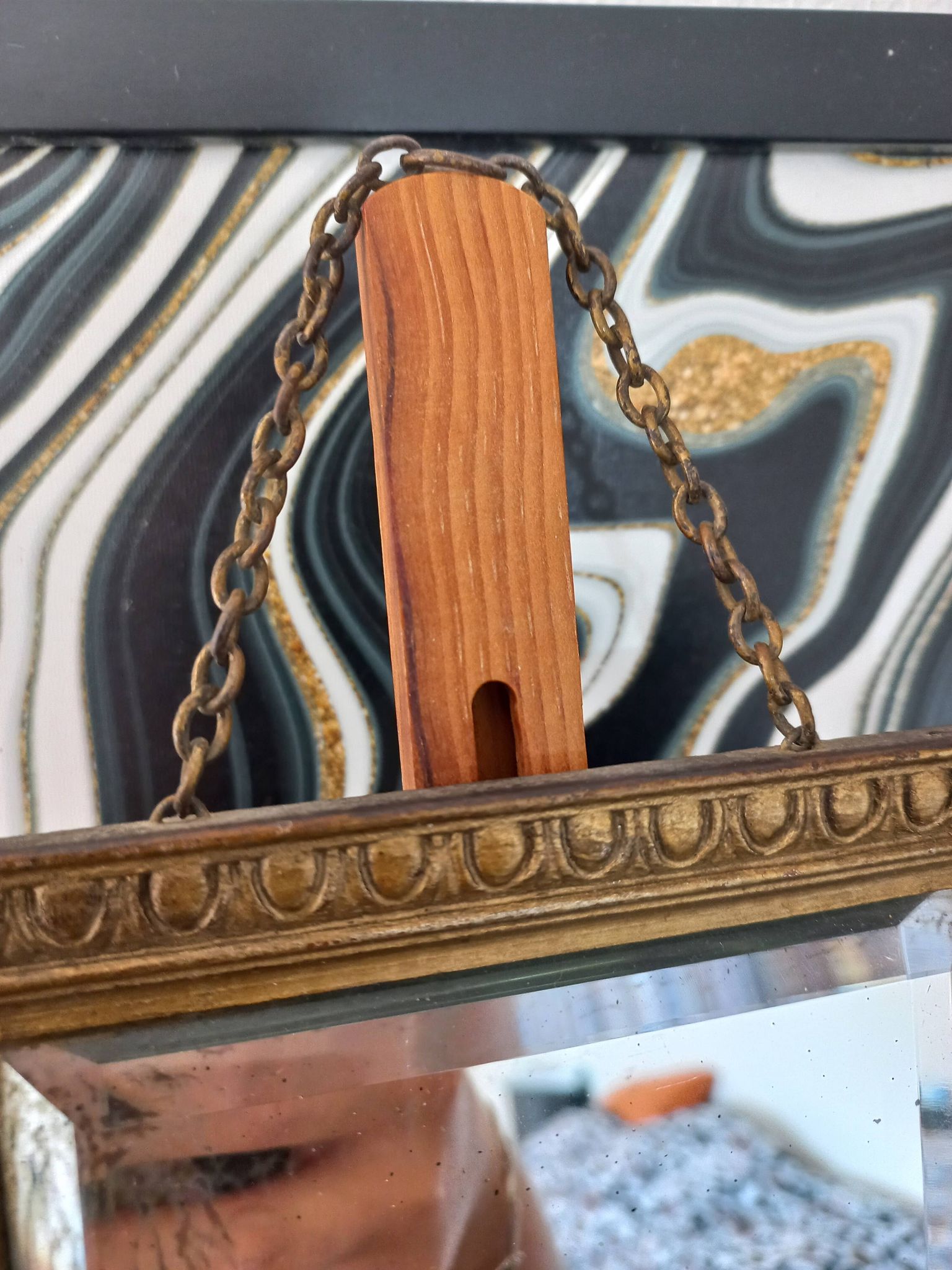Small vintage mirror in gilded wood, bevelled glass with chain.