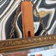 Small vintage mirror in gilded wood, bevelled glass with chain.