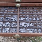 Printing cabinet 16 drawers with these lead letters