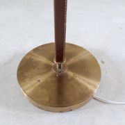 Mid-century brown leather and patinated brass floor lamp by Falkenbergs Belysning, Sweden, 1960s.