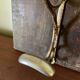 Patinated wood and metal coat rack from the 1950s.