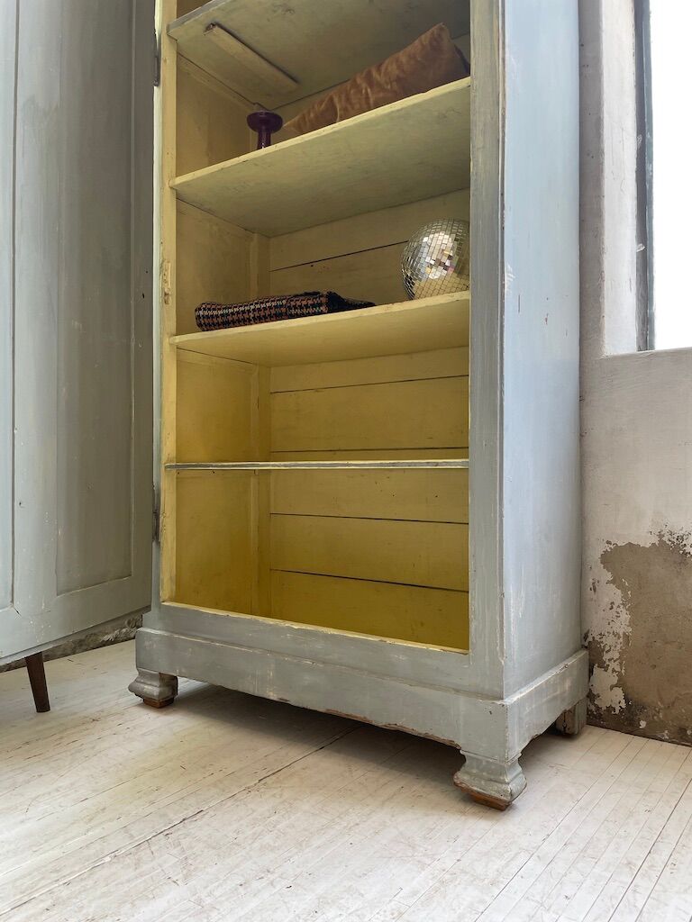 Blue patinated cap cabinet