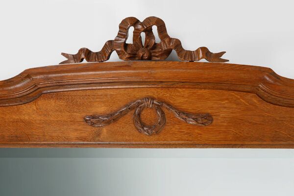 Miroir Art Déco en chêne à décors sculptés et miroir à facettes, années 1930