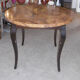 Round table art deco style - elm magnifying glass top and black wooden legs