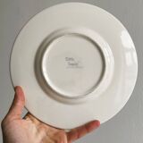 Ceramic plate with black round patterns