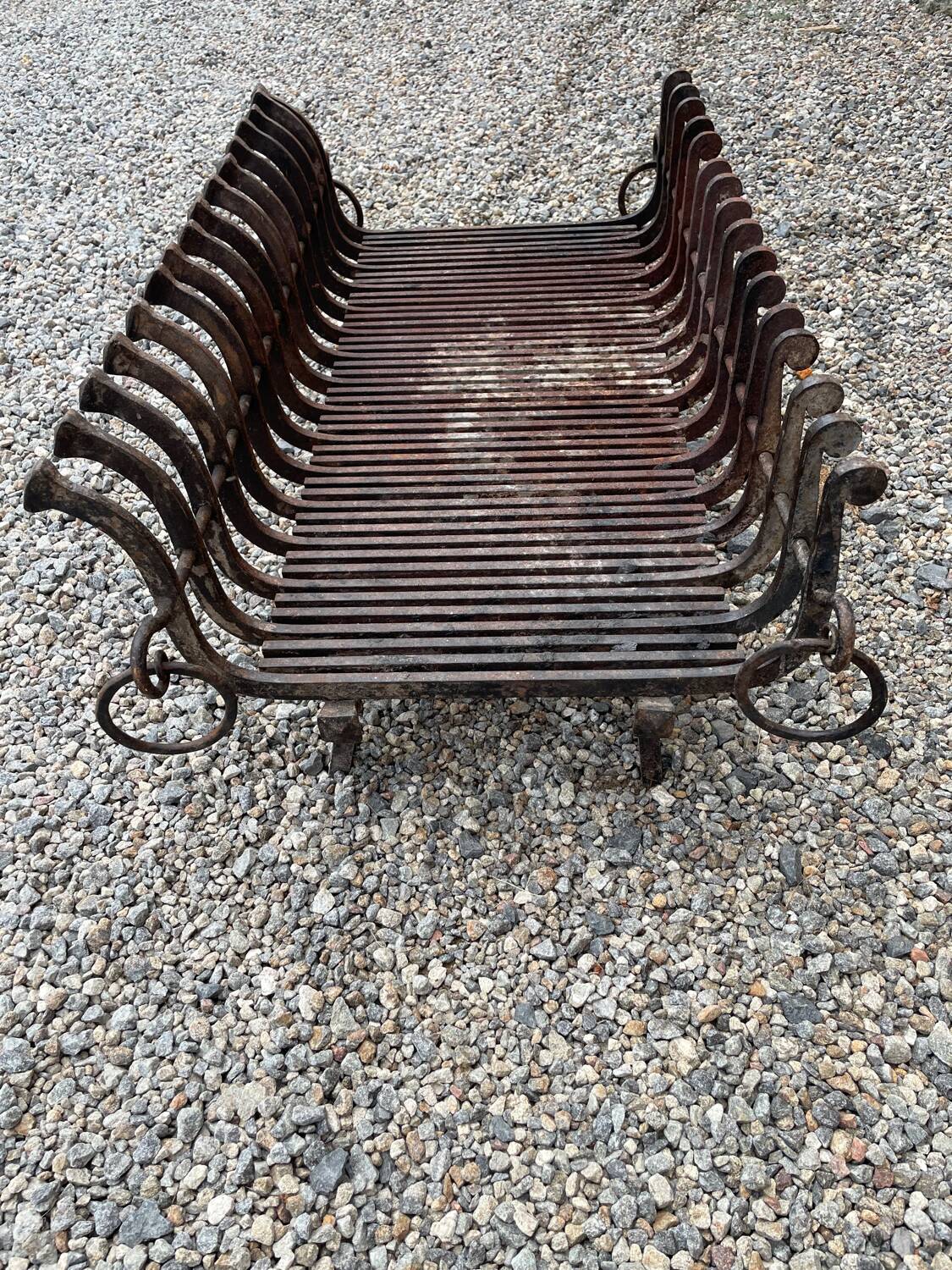 Vintage cast iron fireplace cradle with 16 bars.