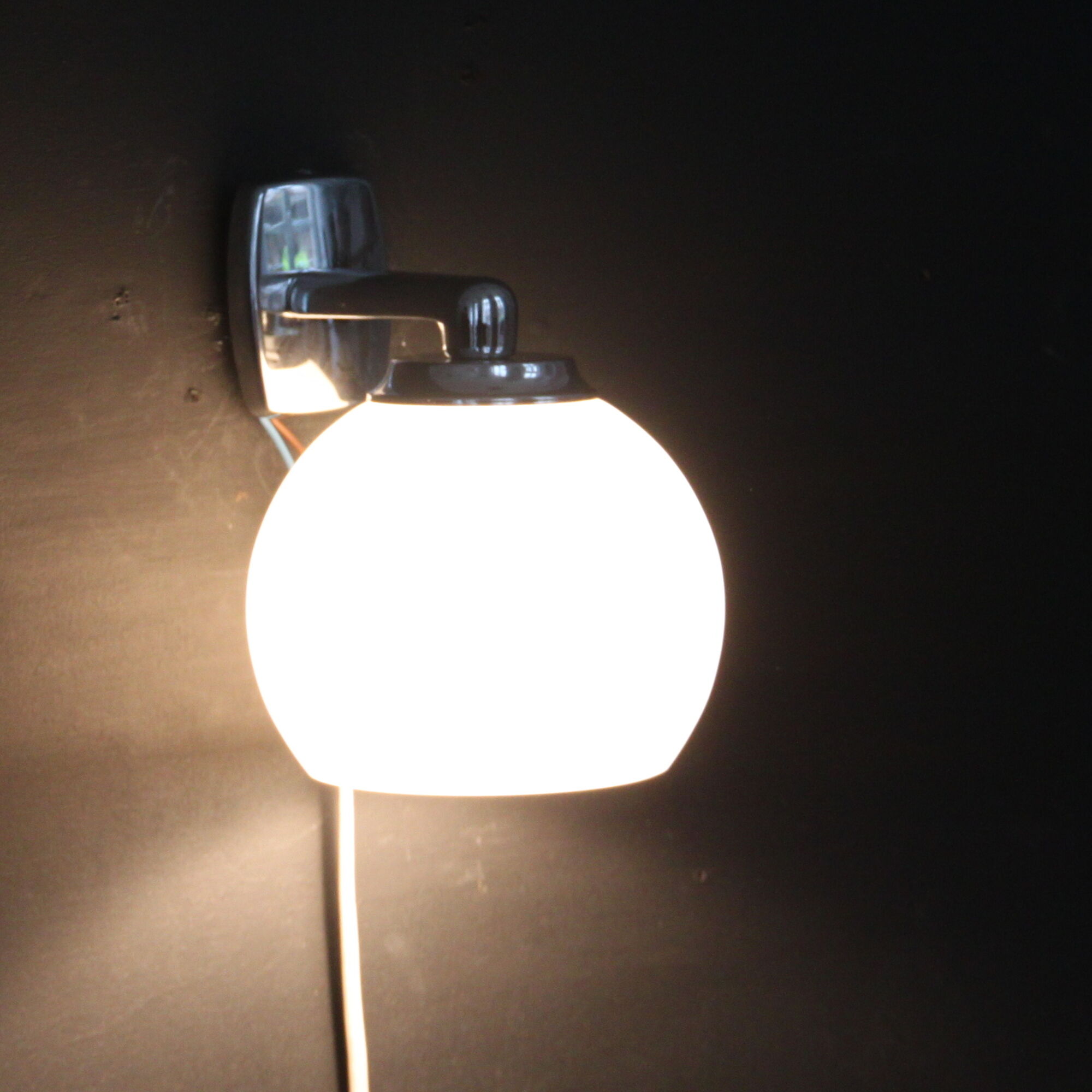 Pair of stainless steel and white glass wall sconces, seventies