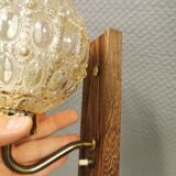 Wall light in rosewood with bobble glass ball shade.