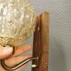 Wall light in rosewood with bobble glass ball shade.