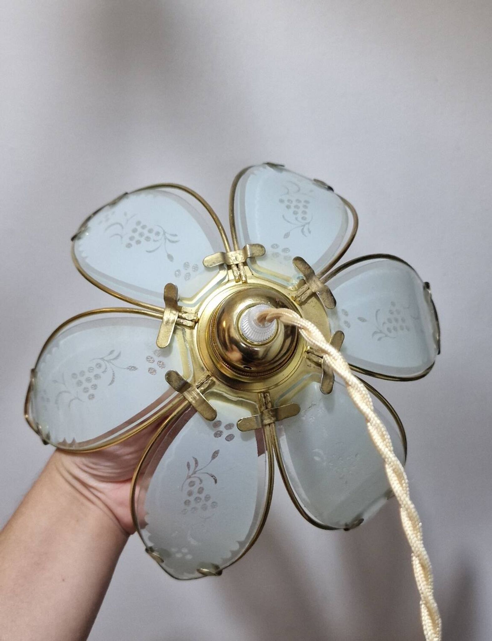 Glass flower rimmed with brass