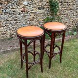 Pair of curved wooden bistro stools with leather seats
