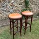 Pair of curved wooden bistro stools with leather seats