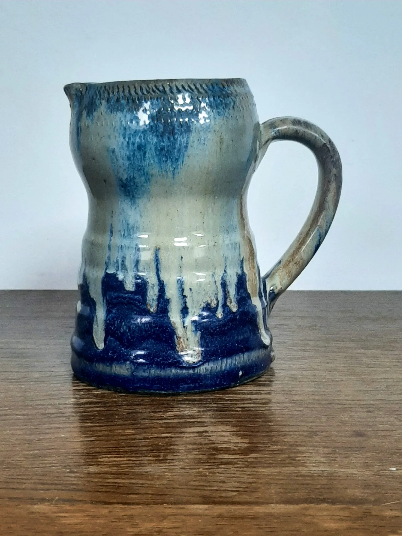 Blue flamed stoneware jug