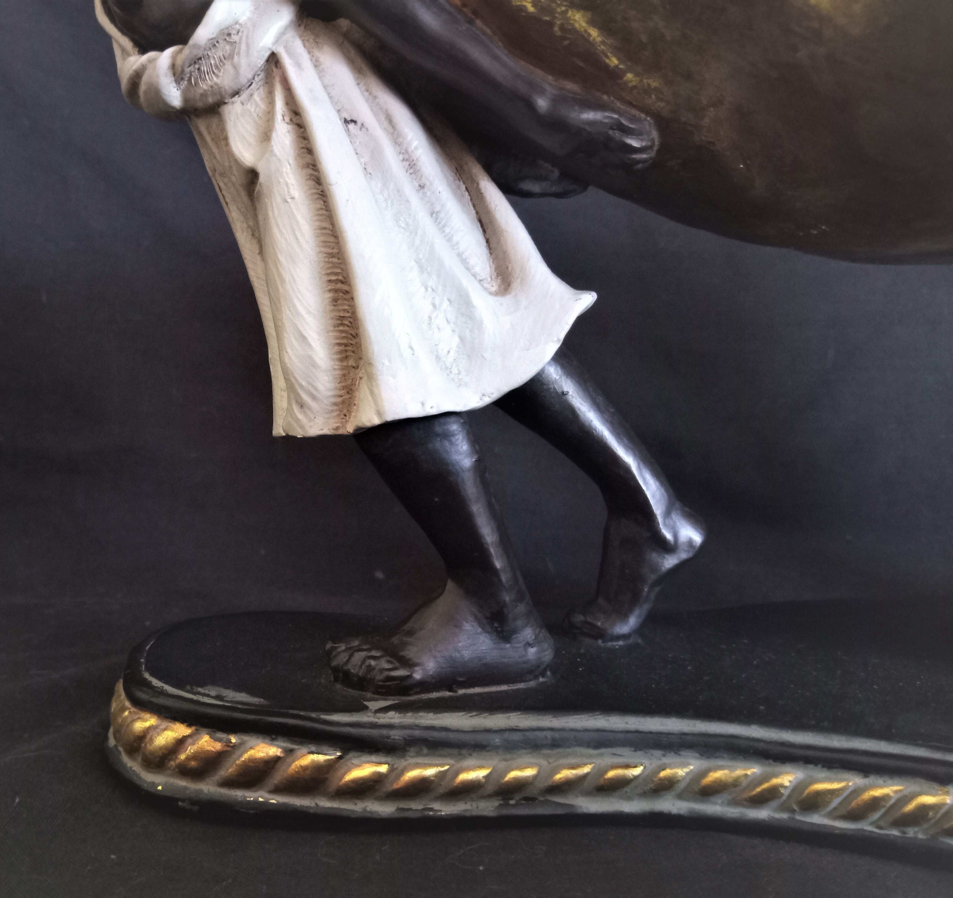 Centerpiece with African characters, plaster, resin and wood