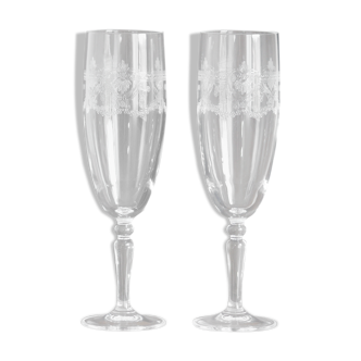 2 crystal champagne flutes of engraved arches