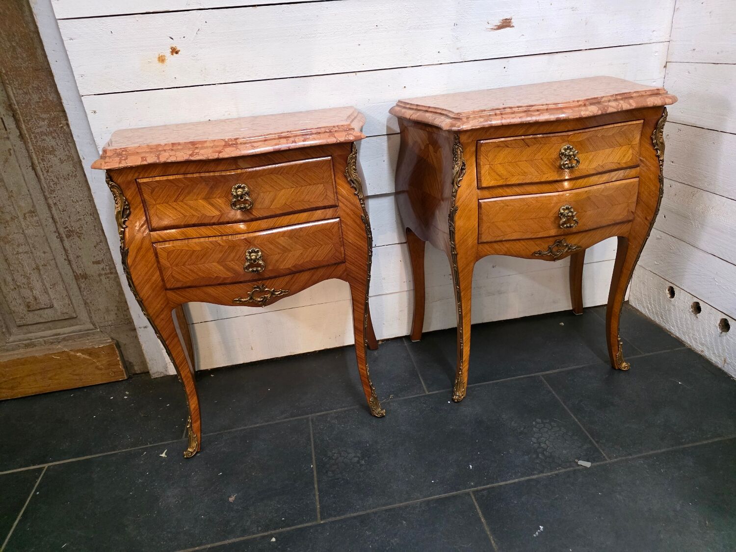Pair of Louis XV style curved bedside tables in marquetry