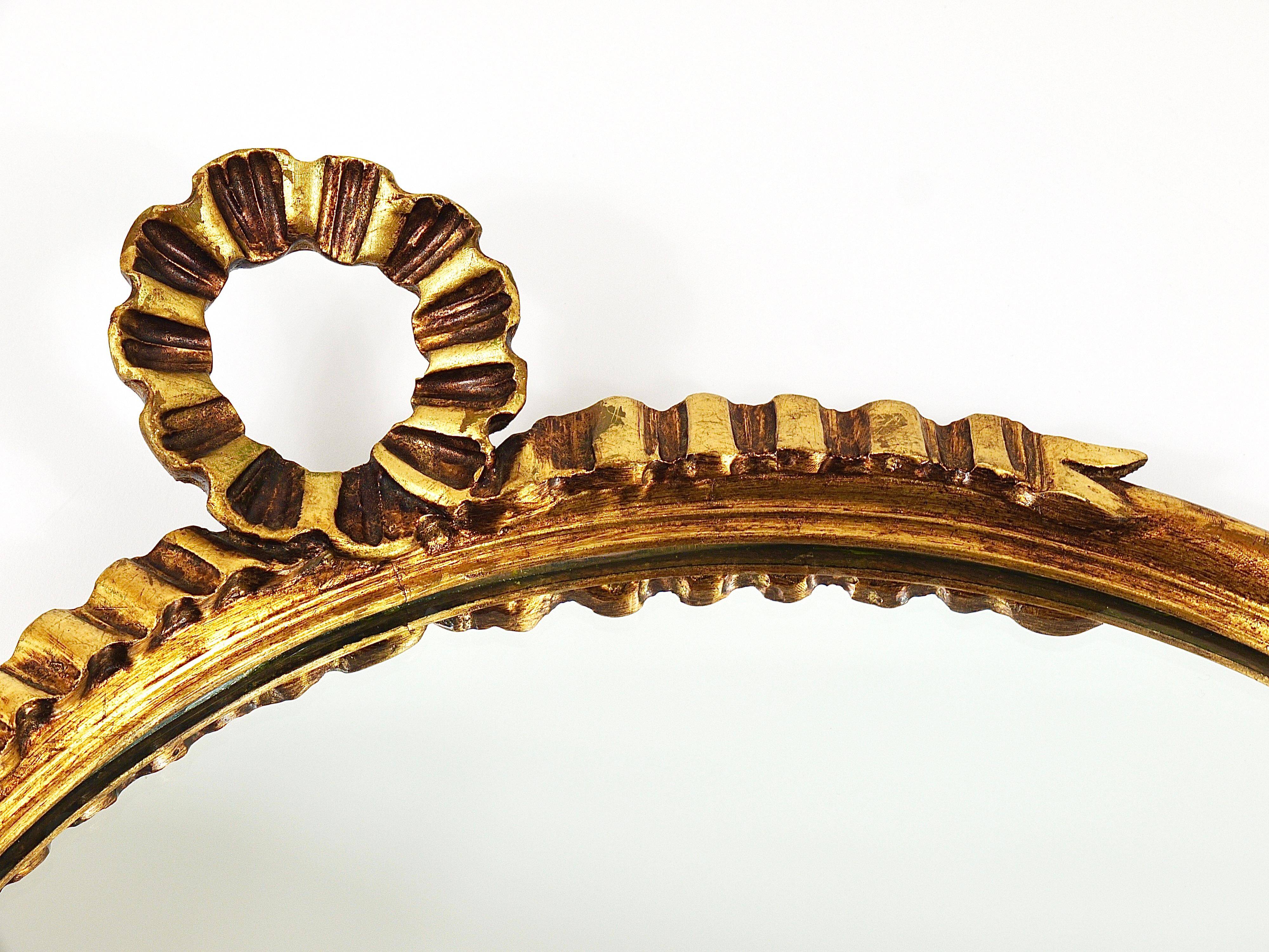 Round wall mirror in gilded wood, mid-century, C. Allodi & G. Subelli, Italy, 1950s.