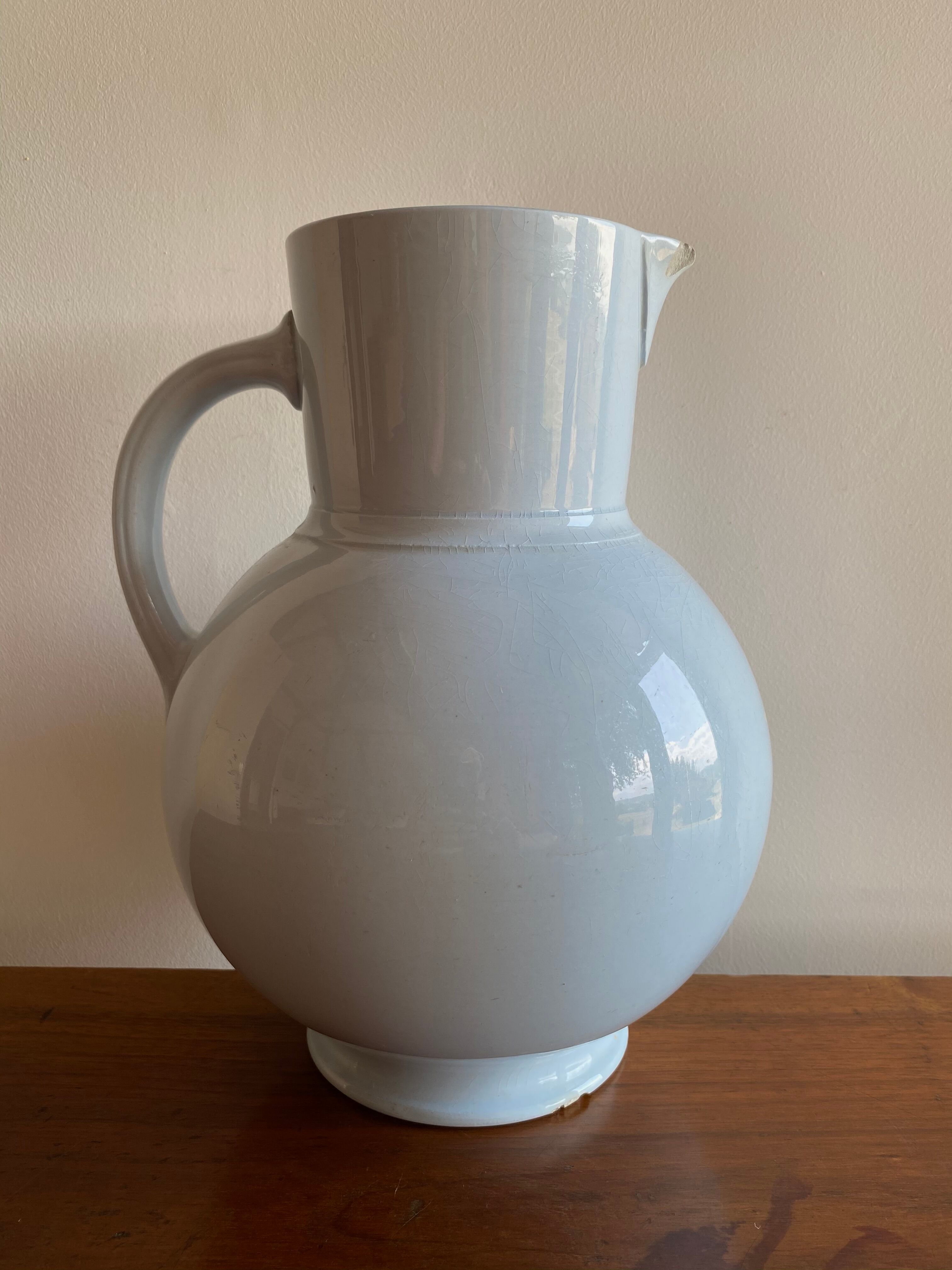 Antique vase in pale blue ceramic