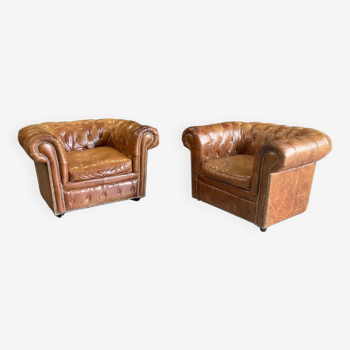 Set of 2 leather Chesterfield armchairs.
