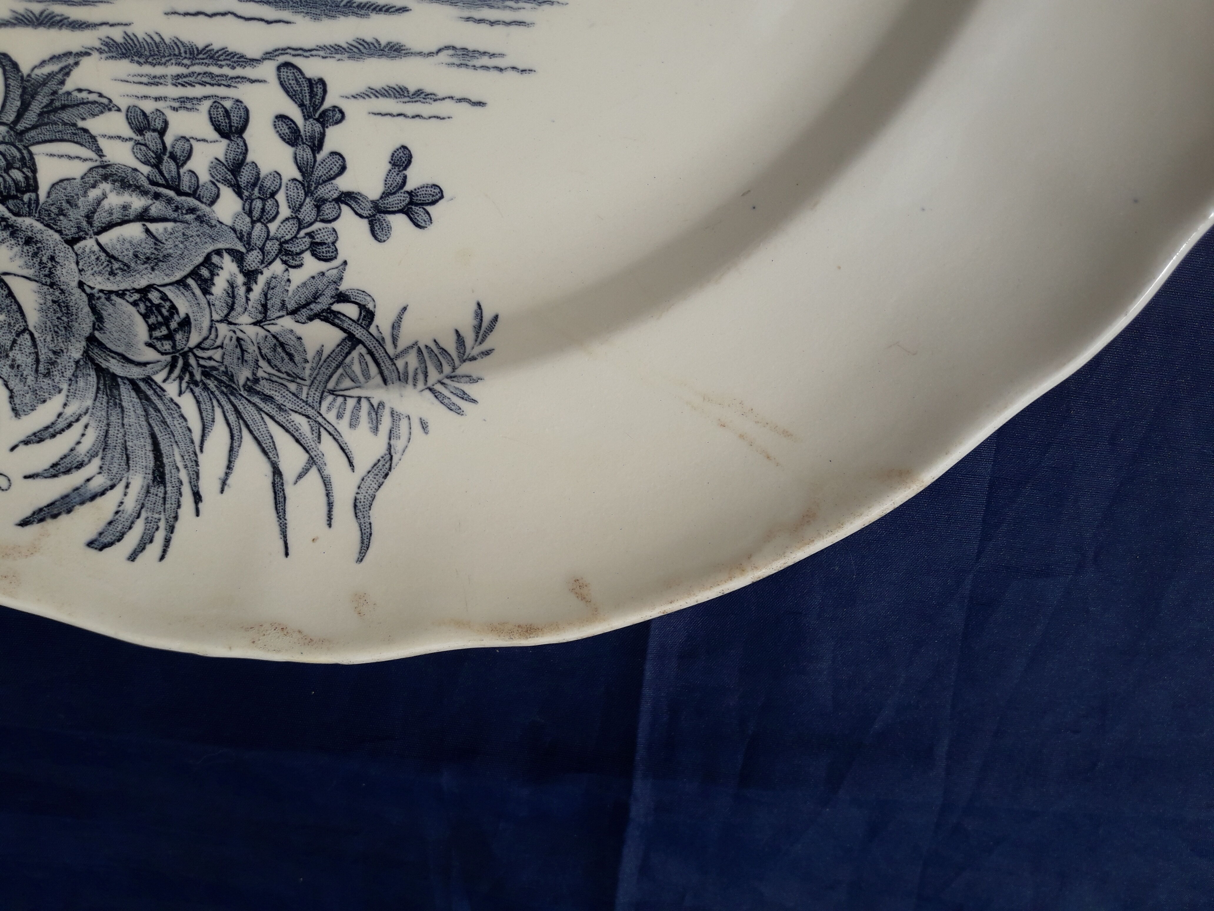 Plat rond en faïence de Longchamp modèle exotique diam 29,5 cm début XXème