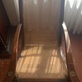 Wooden and straw meridian with foot rest.