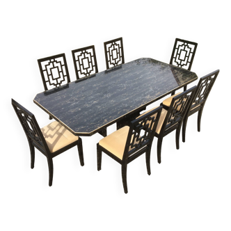 large table from the 1970s in portor marble and 8 black lacquered chairs.