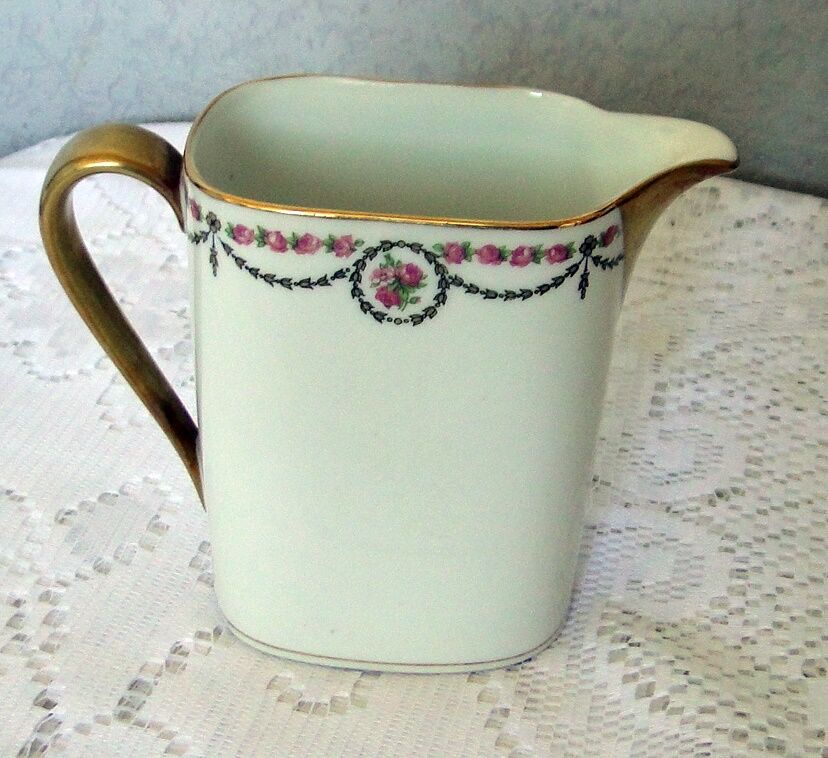 Porcelain milk pot limoges blanche liseret beak and handle dores and garland pink