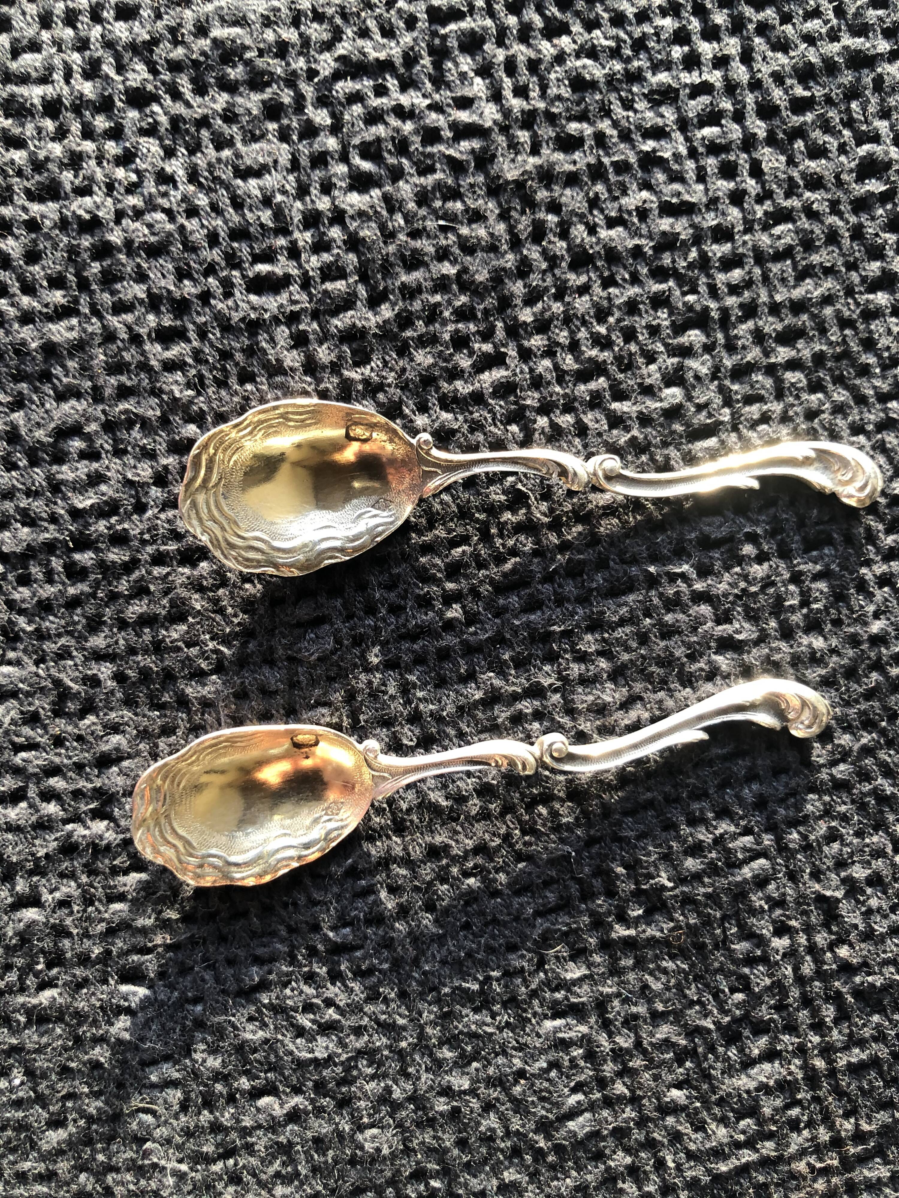 Daum crystal salts and silver spoons