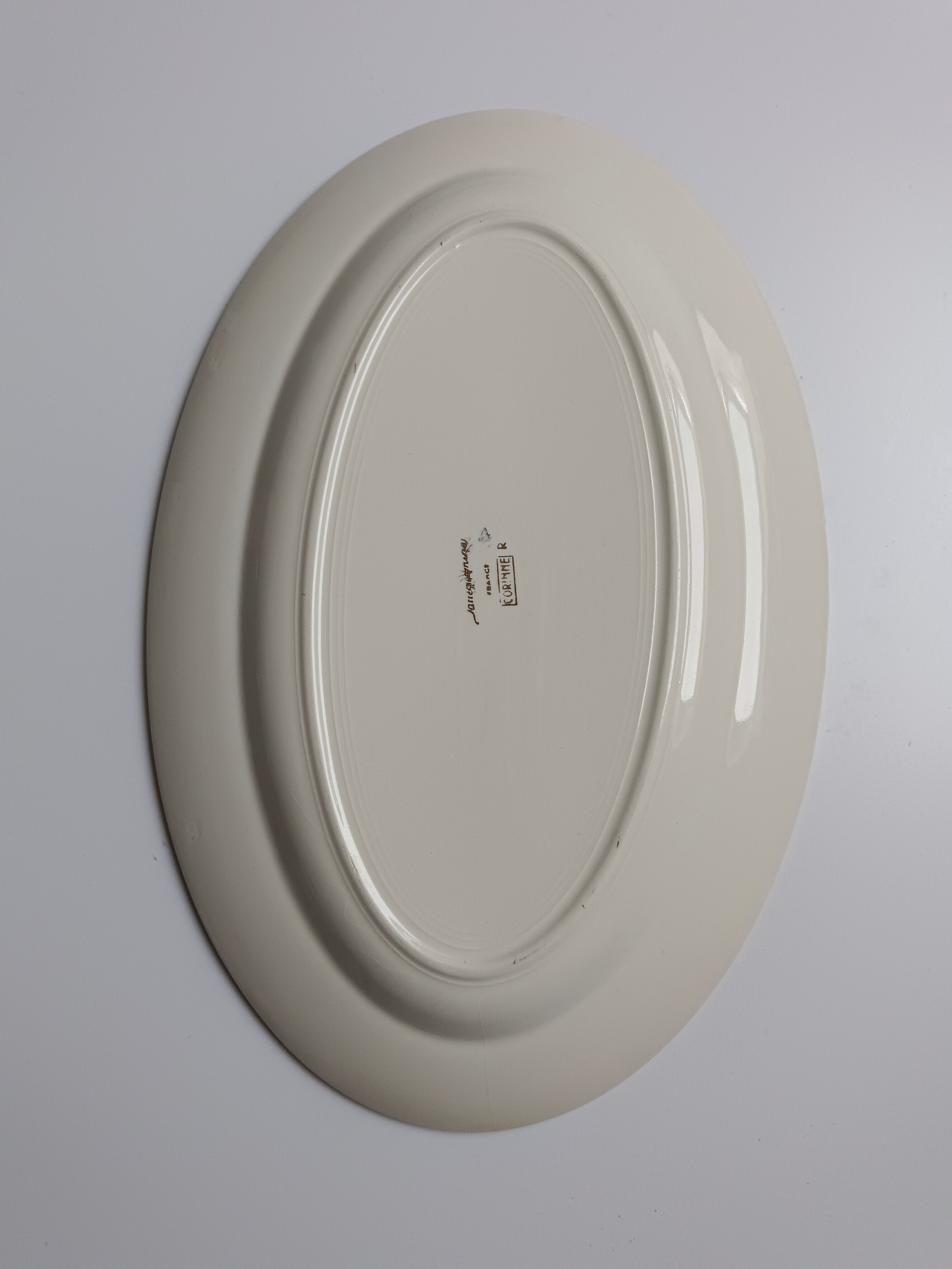 Oval plate Sarreguemines cream with pink gilding, antique.