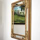 Grand miroir italien doré en bois à verre biseauté