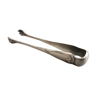 Former silver metal sugar clip by Armand Frenais