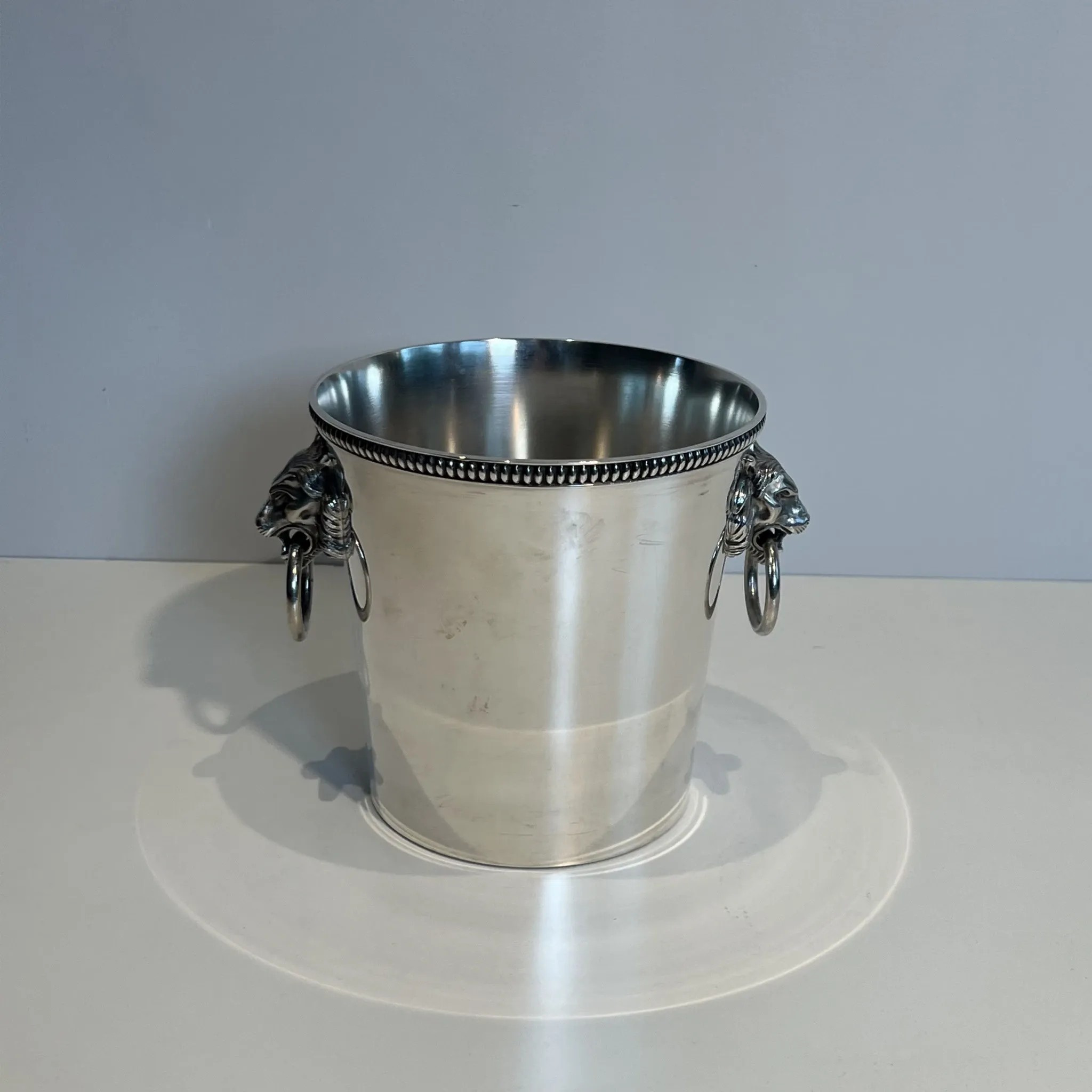 Silver-plated champagne bucket Orfèvrerie Saint-Médard. Handles in the shape of heads.