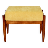 Tabouret Edmund Homa jaune crème avec assise structurale.