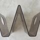 Acrylic magazine rack in the shape of a W - 1970s design.